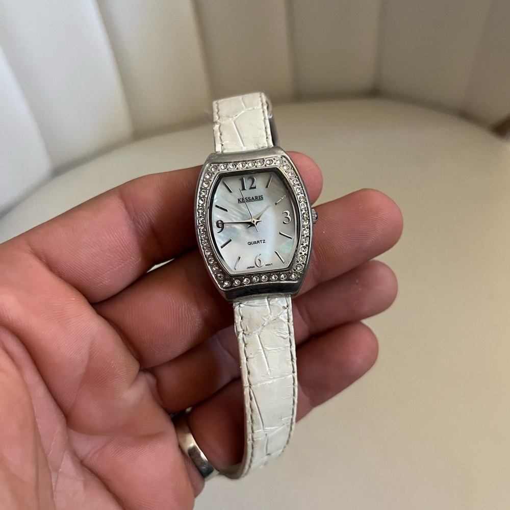 Kessaris white strap quartz backing iced out bezel women’s watch